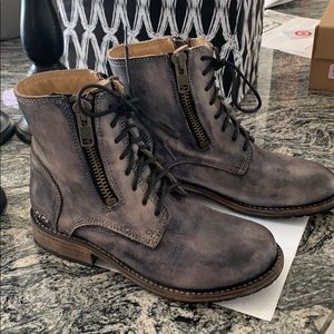 Lace up booties with zipper on each side. Leather.